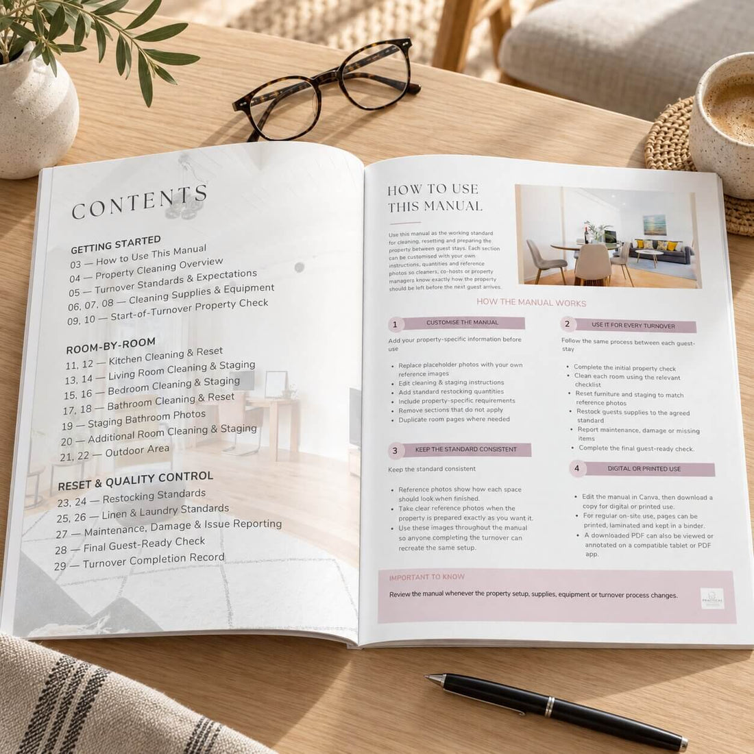 A hardcover book titled 'Holiday Rental Cleaning & Staging Manual' stands open on a wooden table in a softly blurred bedroom setting. The cover is white with faint interior room imagery and black serif text.