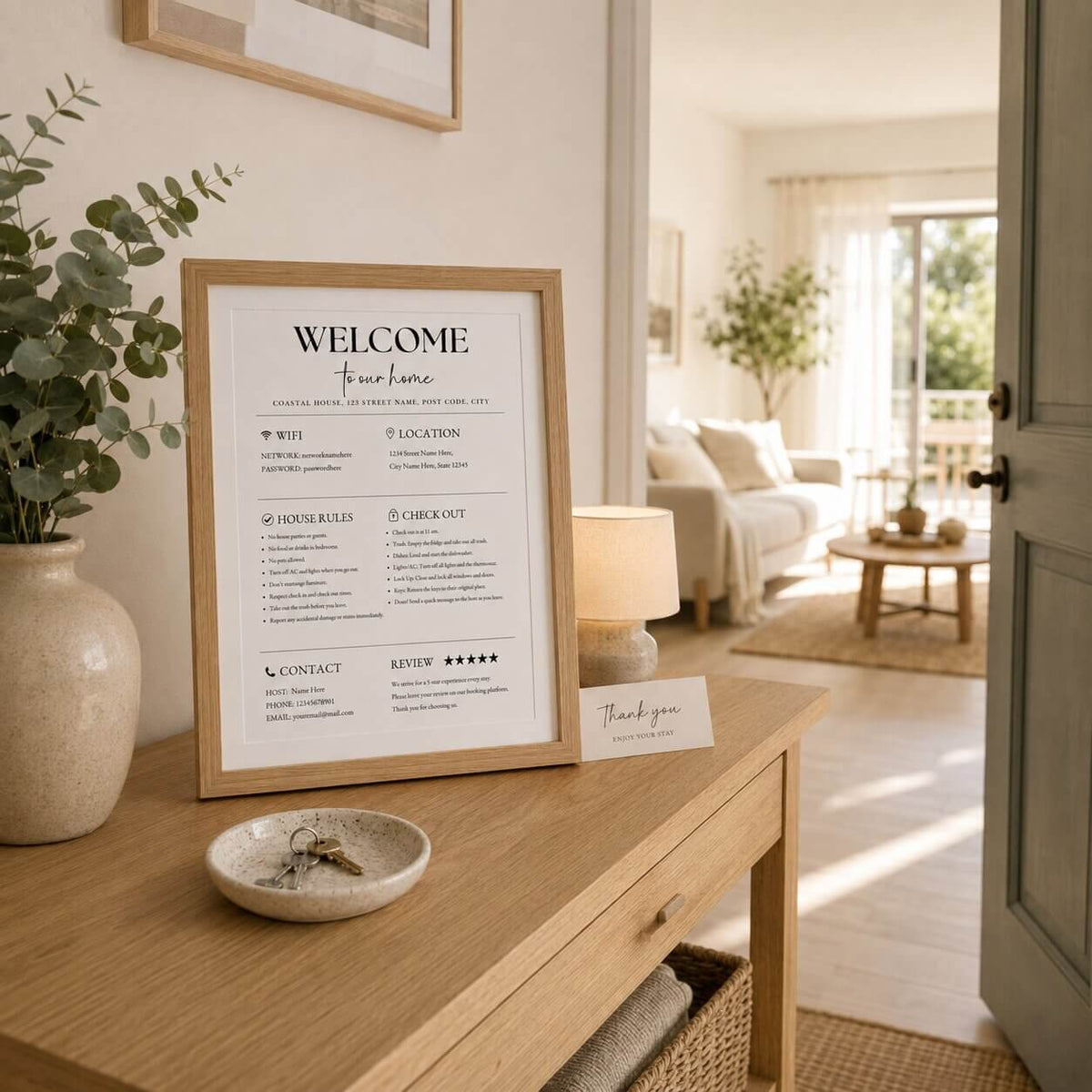 Holiday rental guest information sign displayed on a light oak entrance console