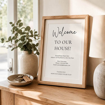 Editable Airbnb welcome sign template displayed in a light oak frame on a console table inside a Scandinavian-style holiday rental.