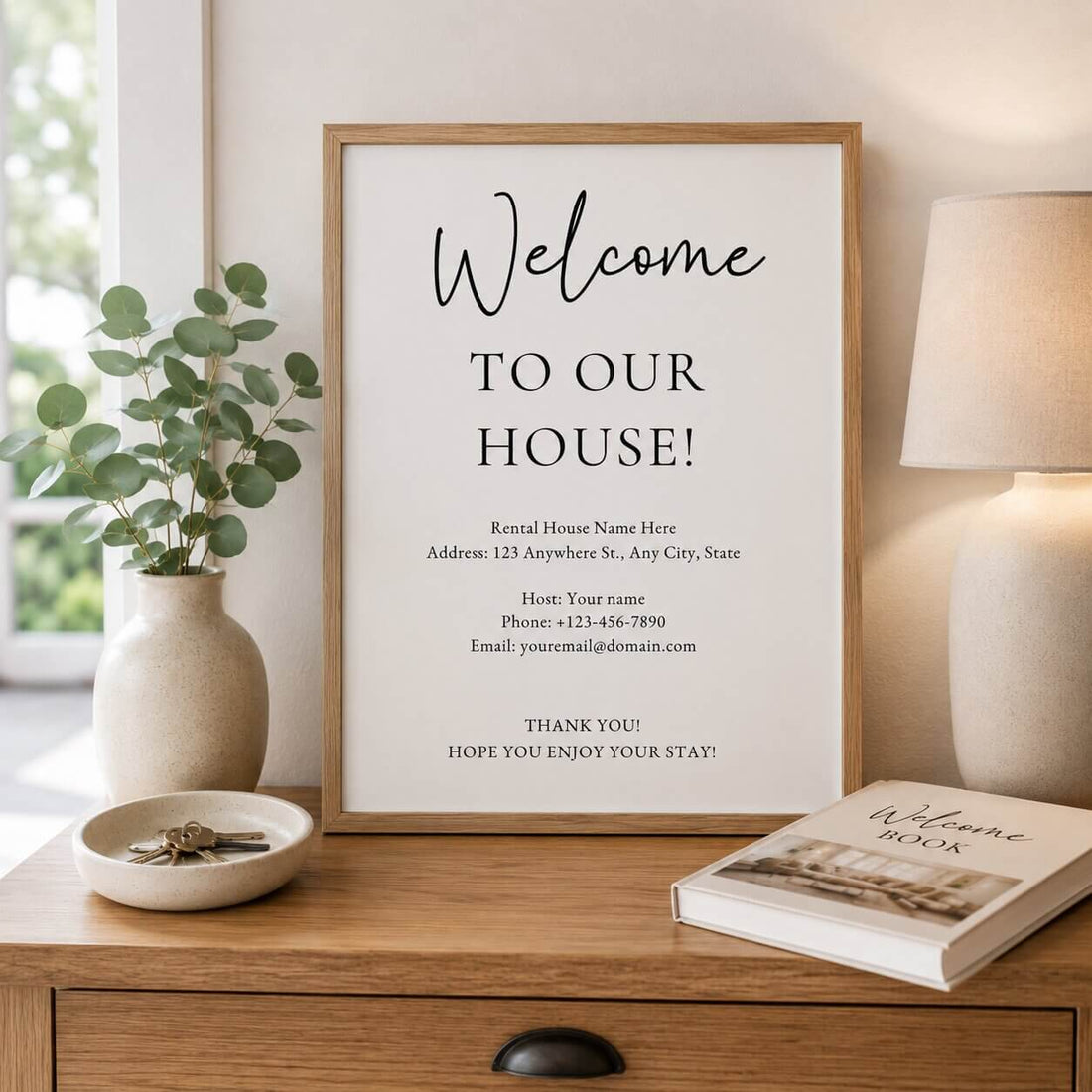 Editable Airbnb welcome sign template displayed in a light oak frame on a console table inside a Scandinavian-style holiday rental.